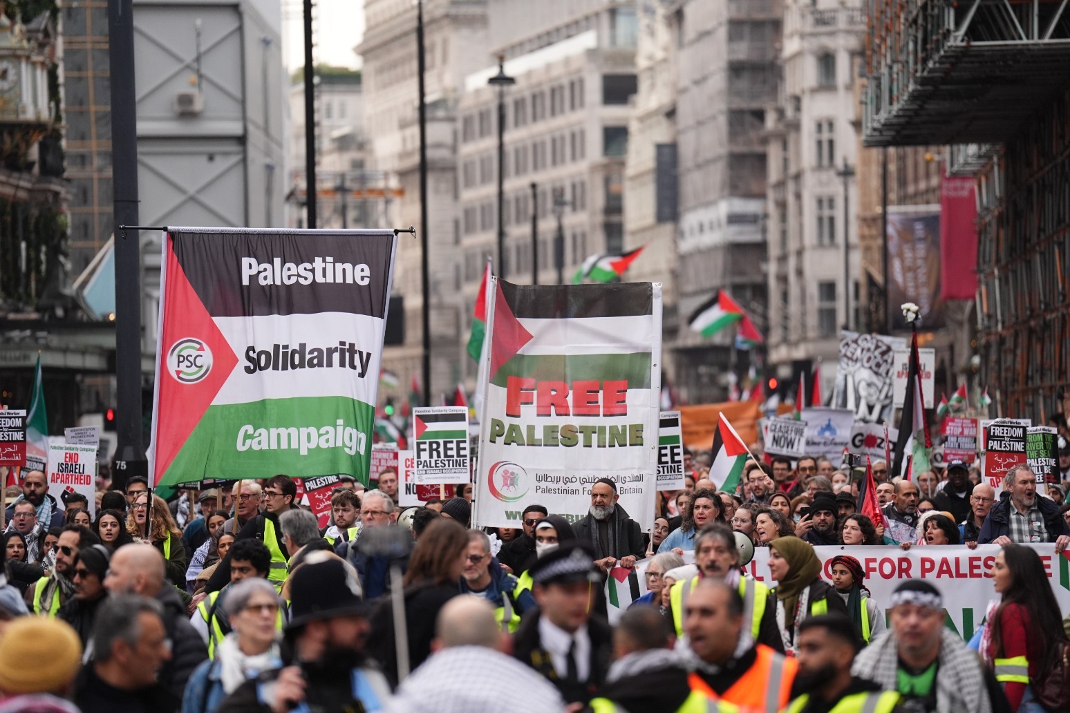 Pro-Palestine group and counter-protesters demonstrate near Christmas shoppers 